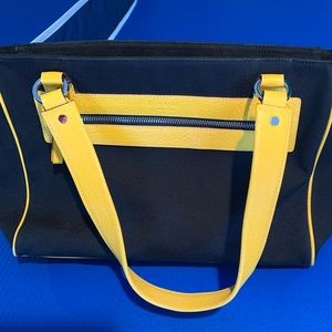 Authentic Kate Spade leather trimmed canvas.